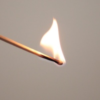 Lighting a match.